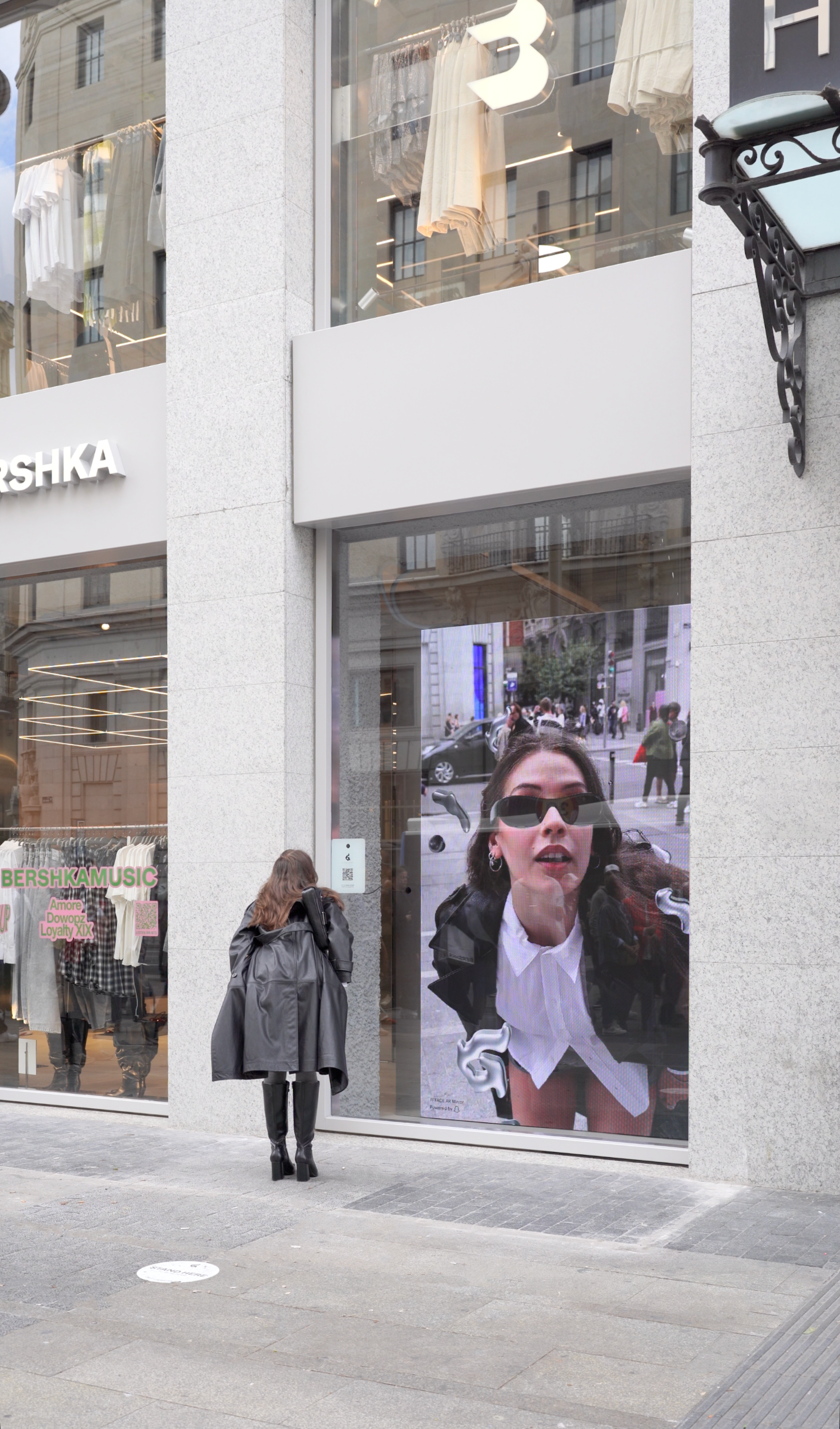 Girl in front of Bershka’s AR Storefront